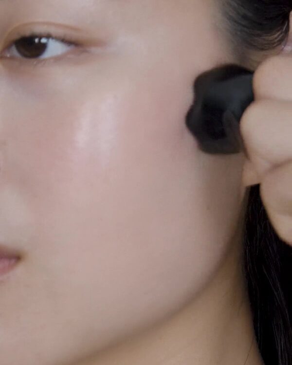 The Face Sculpt Ring gliding along the cheekbone